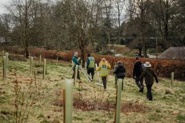 Image from the planting of The Dispersed Memorial Forest in The Crichton & NHS Mountainhall, Dumfries, Scotland.