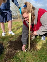 Image from the planting of The Dispersed Memorial Forest in The Crichton & NHS Mountainhall, Dumfries, Scotland.