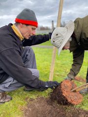 Image from the planting of The Dispersed Memorial Forest in The Crichton & NHS Mountainhall, Dumfries, Scotland.