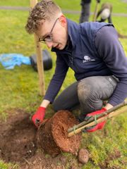 Image from the planting of The Dispersed Memorial Forest in The Crichton & NHS Mountainhall, Dumfries, Scotland.
